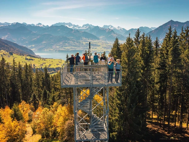 View from the Blueme route of Lake Thun, the Niesen, and the Bernese Alps